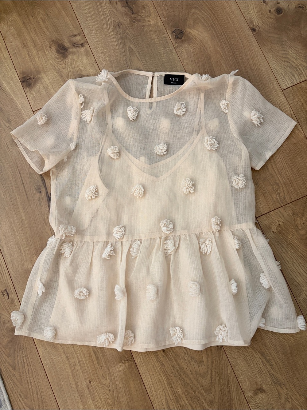 VICI Cream Short Sleeve Sheer Peplum Top with Floral Pom Appliqués